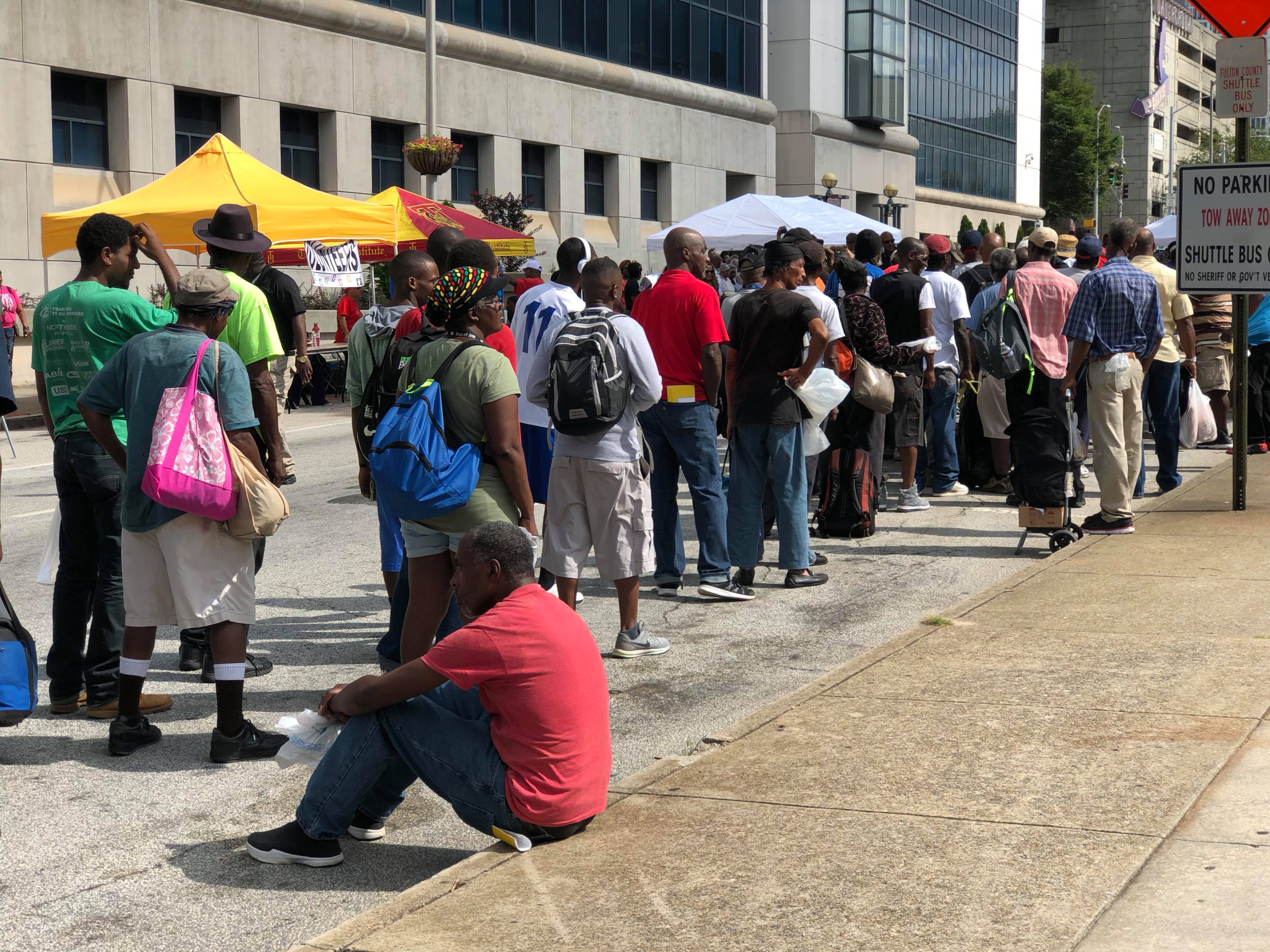 A long line of people waiting at the City of Atlanta's 8th Annual Homeless Outreach