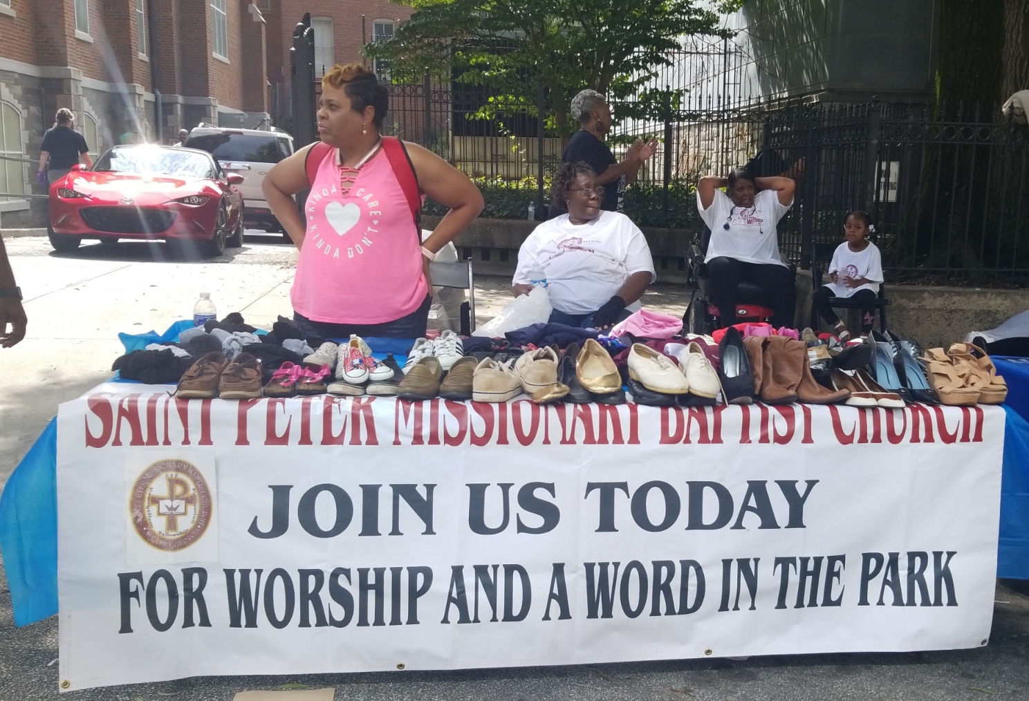 Community members and volunteers gathered at the outreach