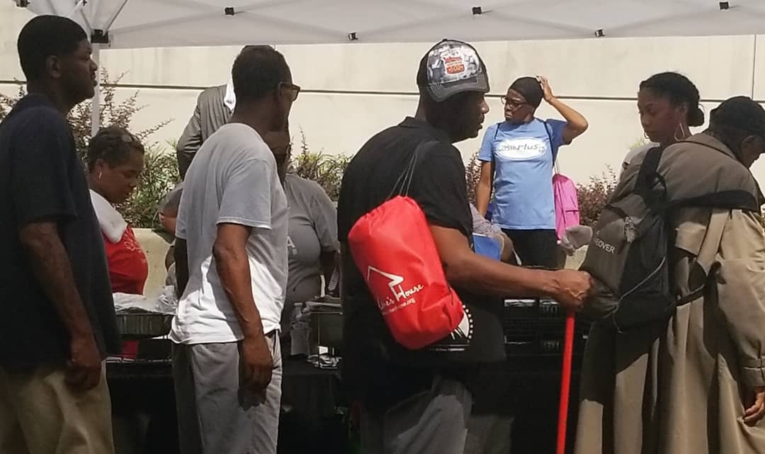 Volunteers distributing supplies at the outreach event