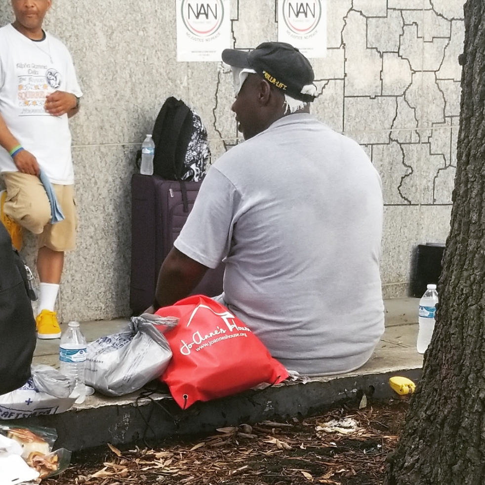Community members receiving care bags at the outreach