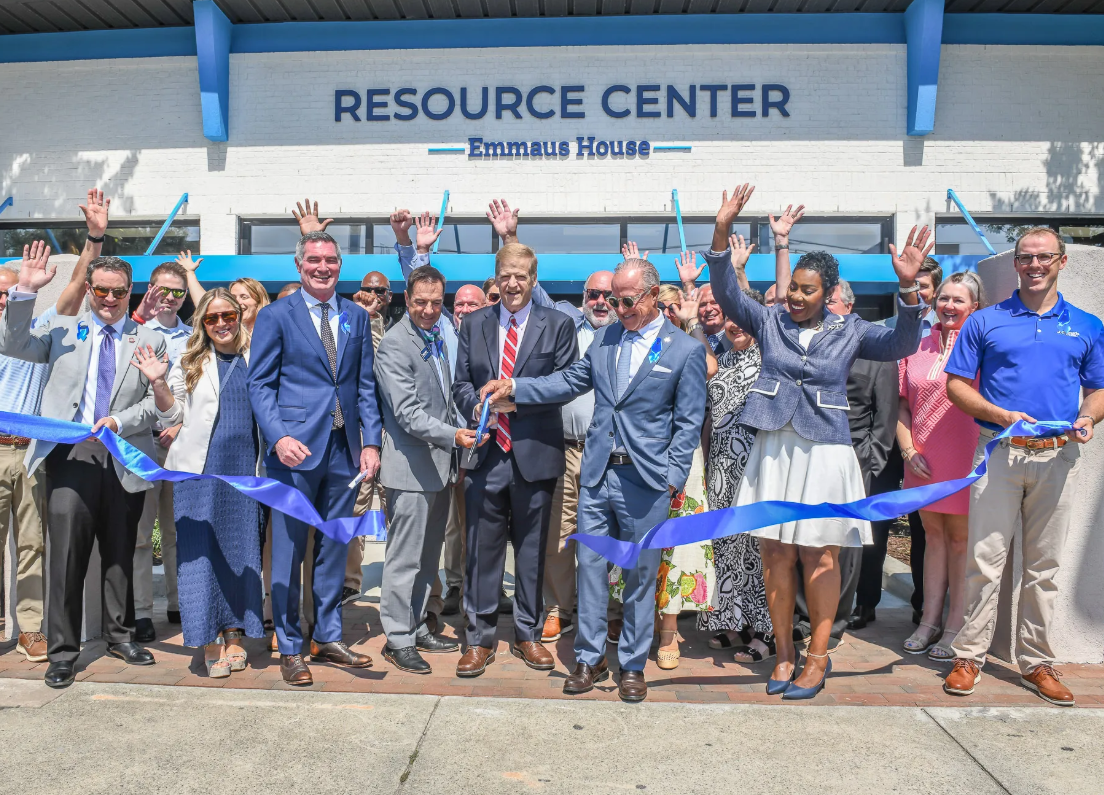 Community leaders cut a ribbon in front of the new Emmaus House Resource Center in Savannah
